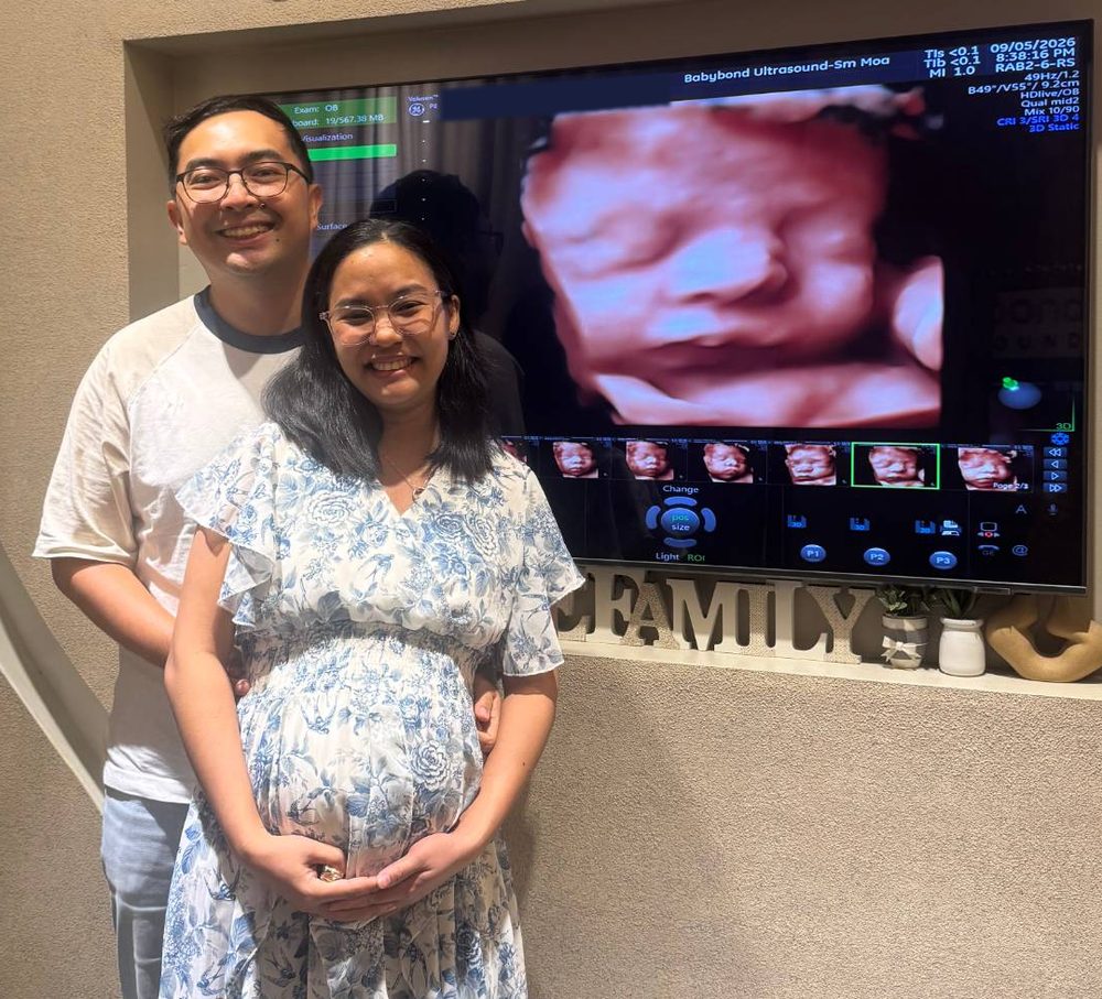 Gen and Hope at Baby E’s 3D ultrasound, with Baby E’s face on the screen behind them